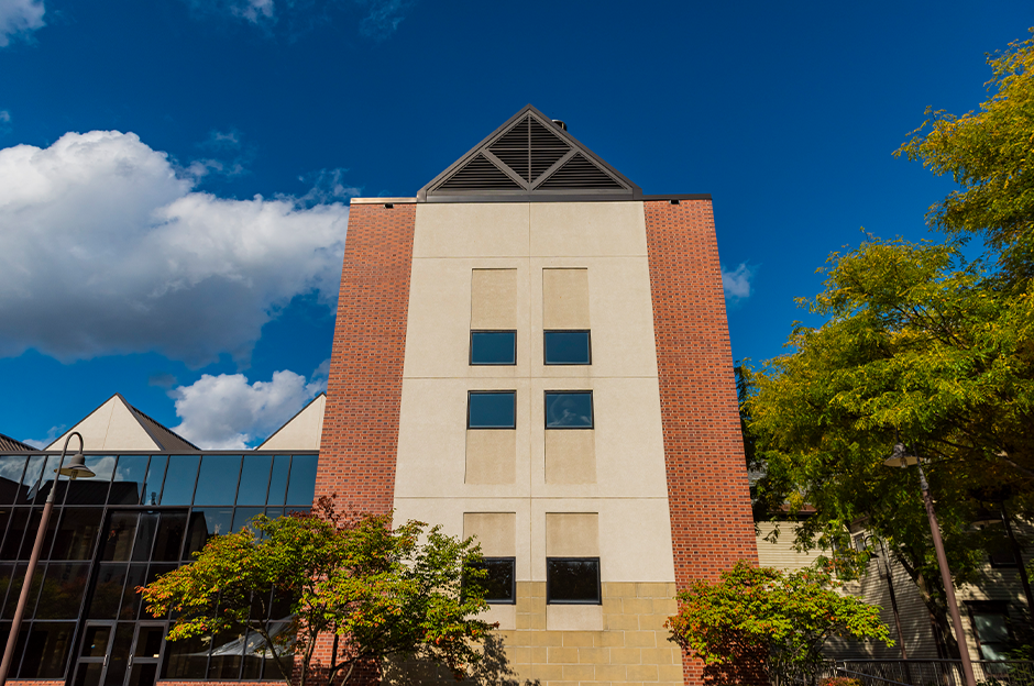 studio building image with blue skies and clouds in background
