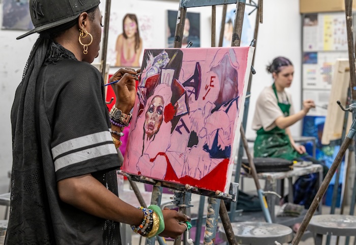 man painting in the studio