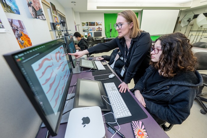 teaching showing student illustration direction on screen