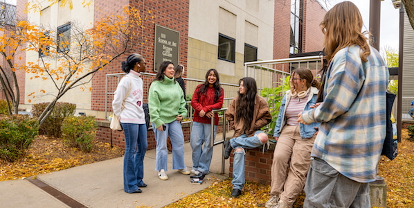 students out front Pratt Munson in the fall