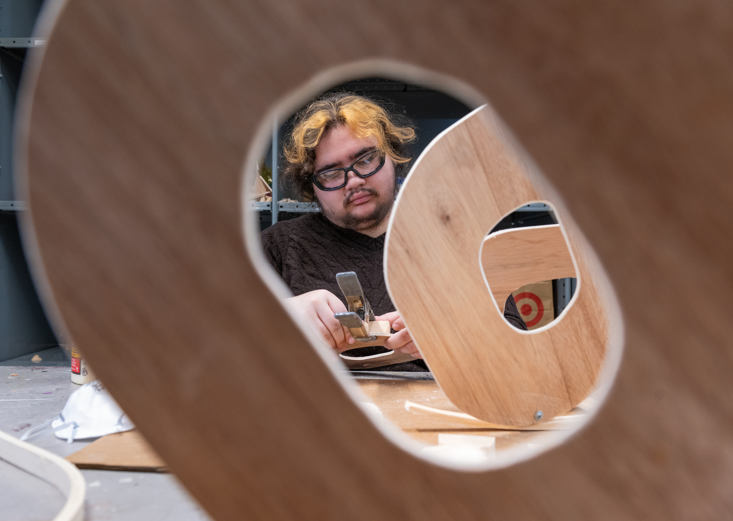 student working onwooden sculpsture