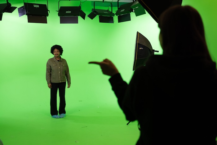 person in front of green screen