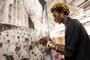 Student engaged and artwork