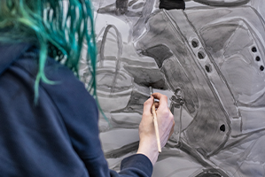 student painting in black and white at pratt munson utica ny