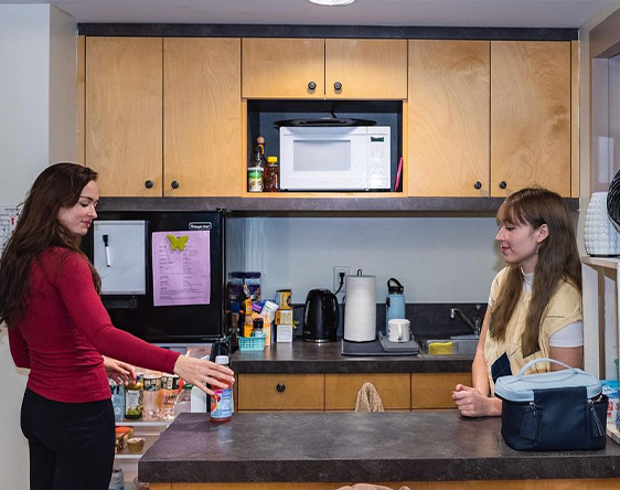 students in kitchen in dorm